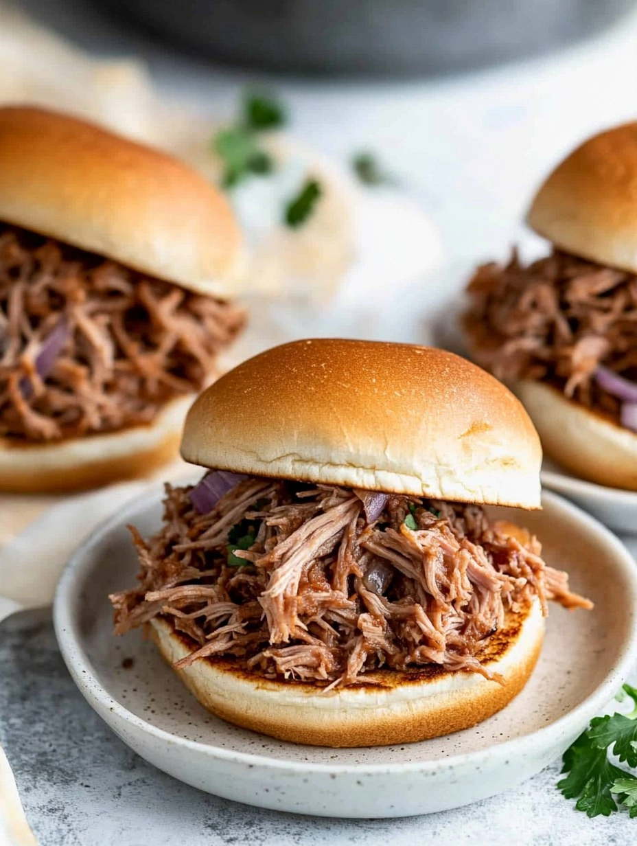 Slow Cooker Pulled Pork | Tender Shredded Pork Sandwiches
